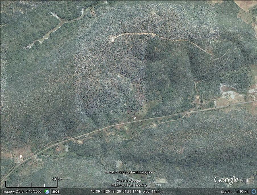 The Chakwenga Headwaters. The Chakwenga arises in the dambo at the bottom left of the photograph (B), and flows eastward before turning south towards its confluence with the Zambezi. A winding track leads to transmitting towers at the crest of the hill. The Nyabutaye (A) is a short tributary of the Chakwenga.